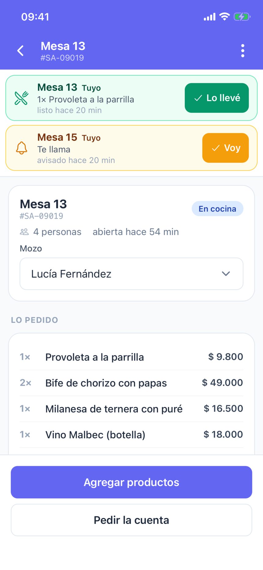 La mesa 13 en cocina, con 4 personas, el mozo Lucía Fernández y lo pedido: provoleta, dos bifes de chorizo, milanesa y un Malbec